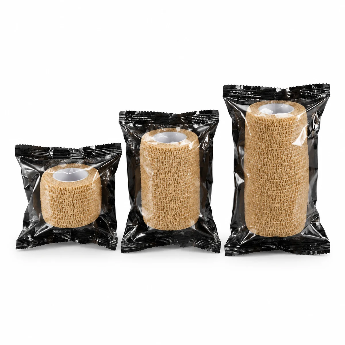Three individually wrapped self-adhesive elastic bandage rolls in different widths, on a white background