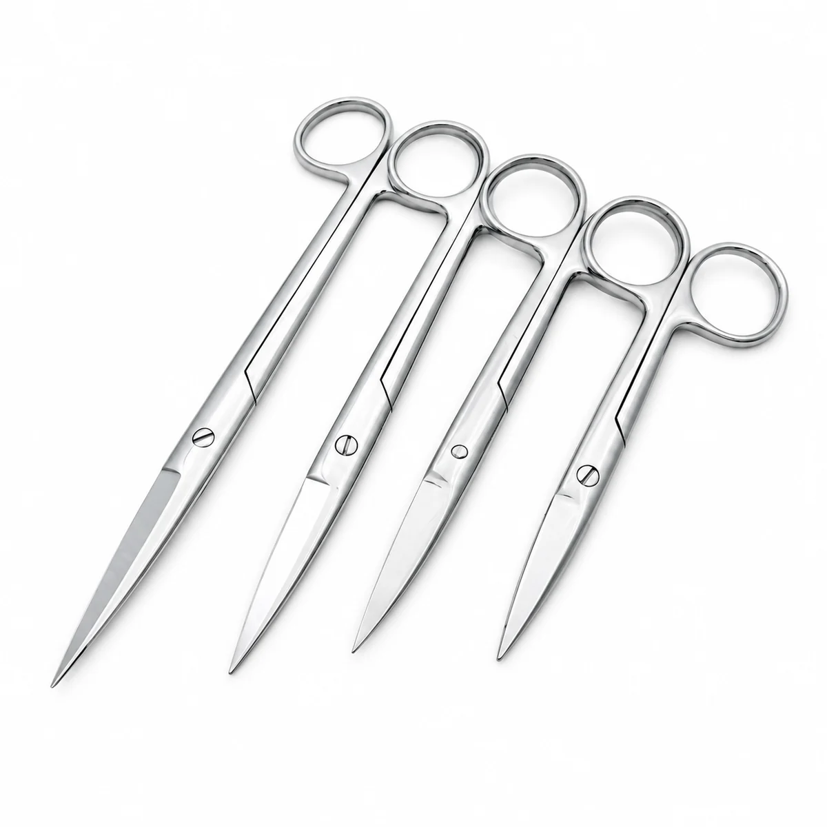 Four stainless steel surgical scissors fanned out side by side, on a white background